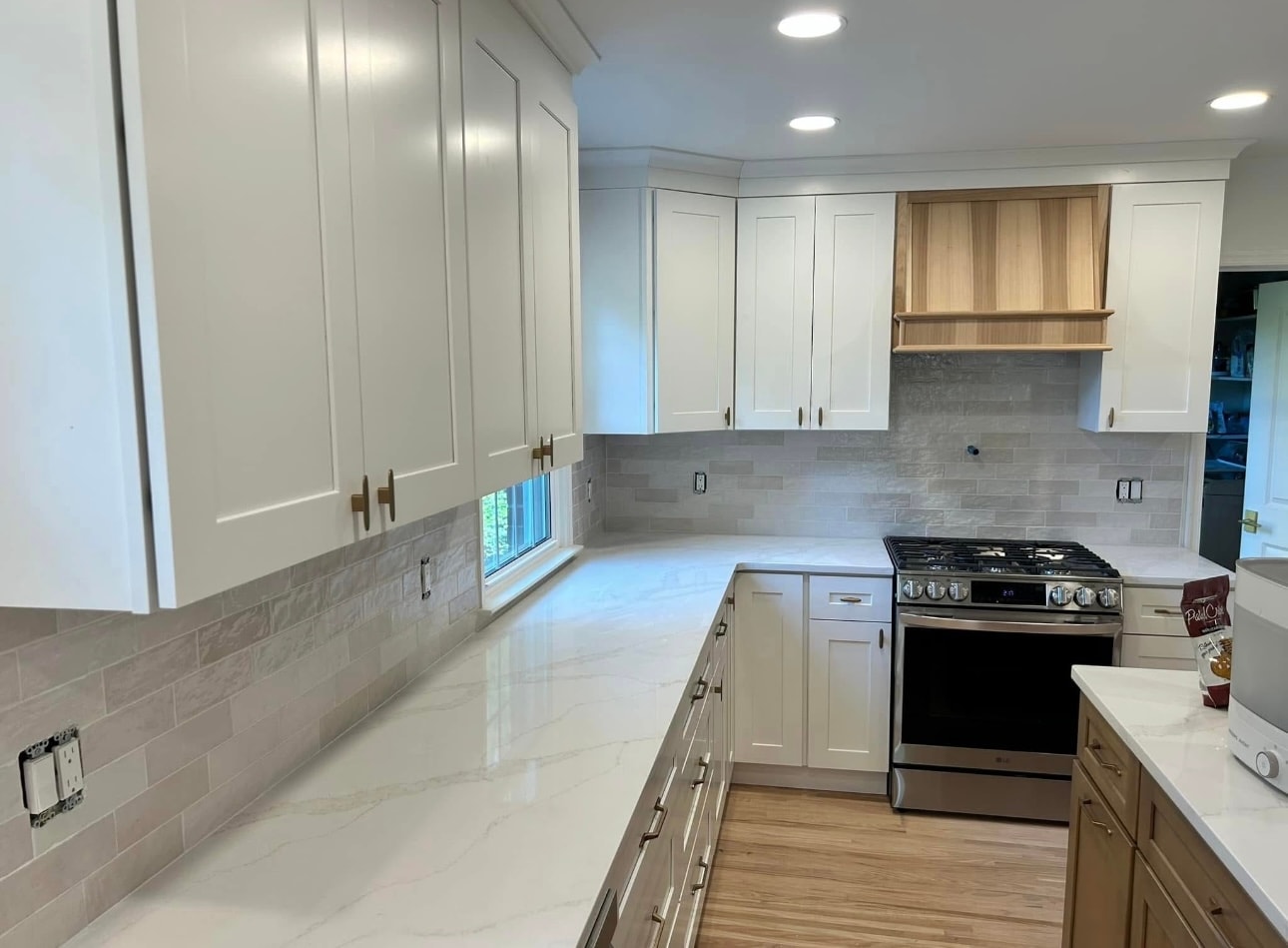 Modern kitchen white cabinets stainless appliances